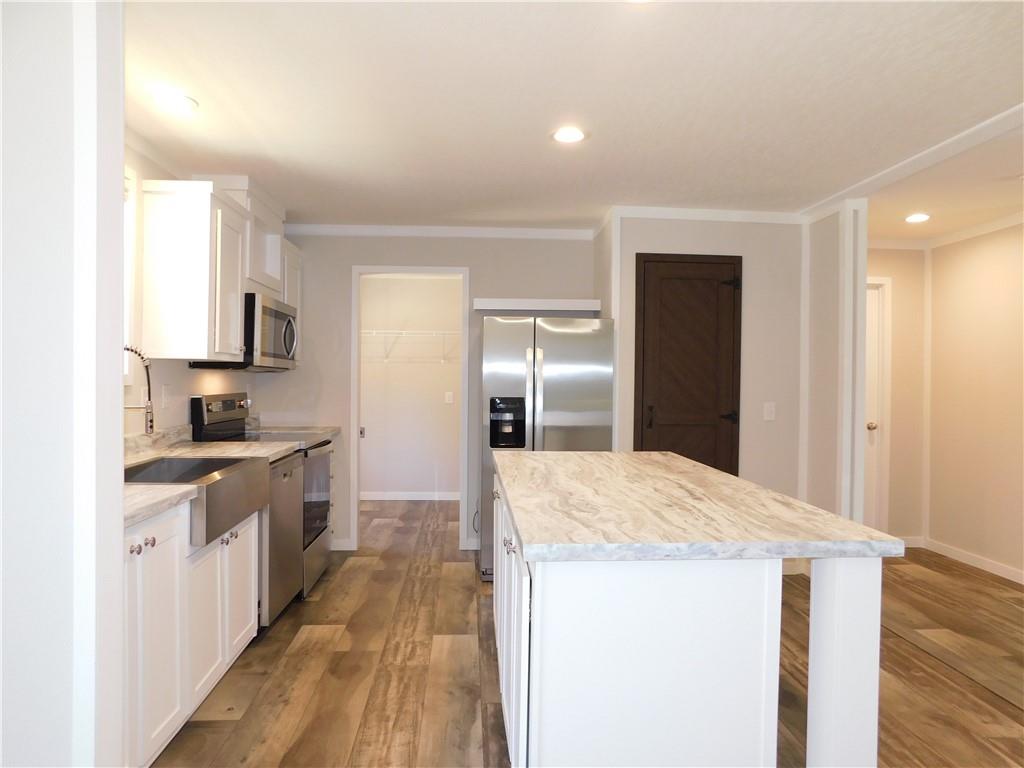 350 Galahad Road Dahlonega, GA 30533 - Photo 14 of 39 a kitchen with a sink and refrigerator