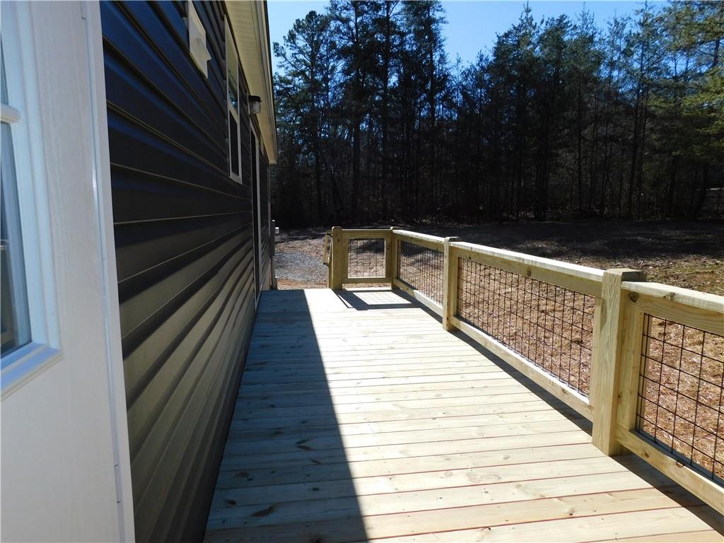 350 Galahad Road Dahlonega, GA 30533 - Photo 21 of 39 a balcony with view of wooden floor