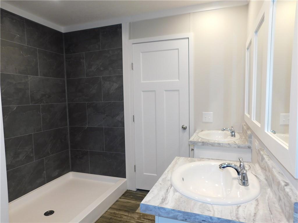 350 Galahad Road Dahlonega, GA 30533 - Photo 27 of 39 a bathroom with a sink and a bathtub