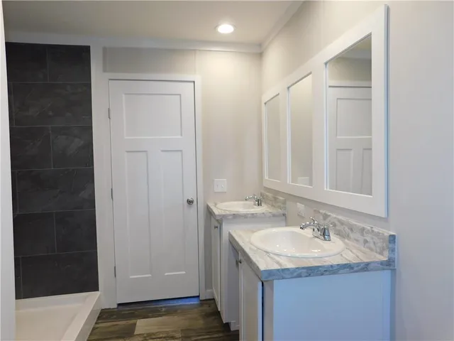 a bathroom with a sink and a mirror