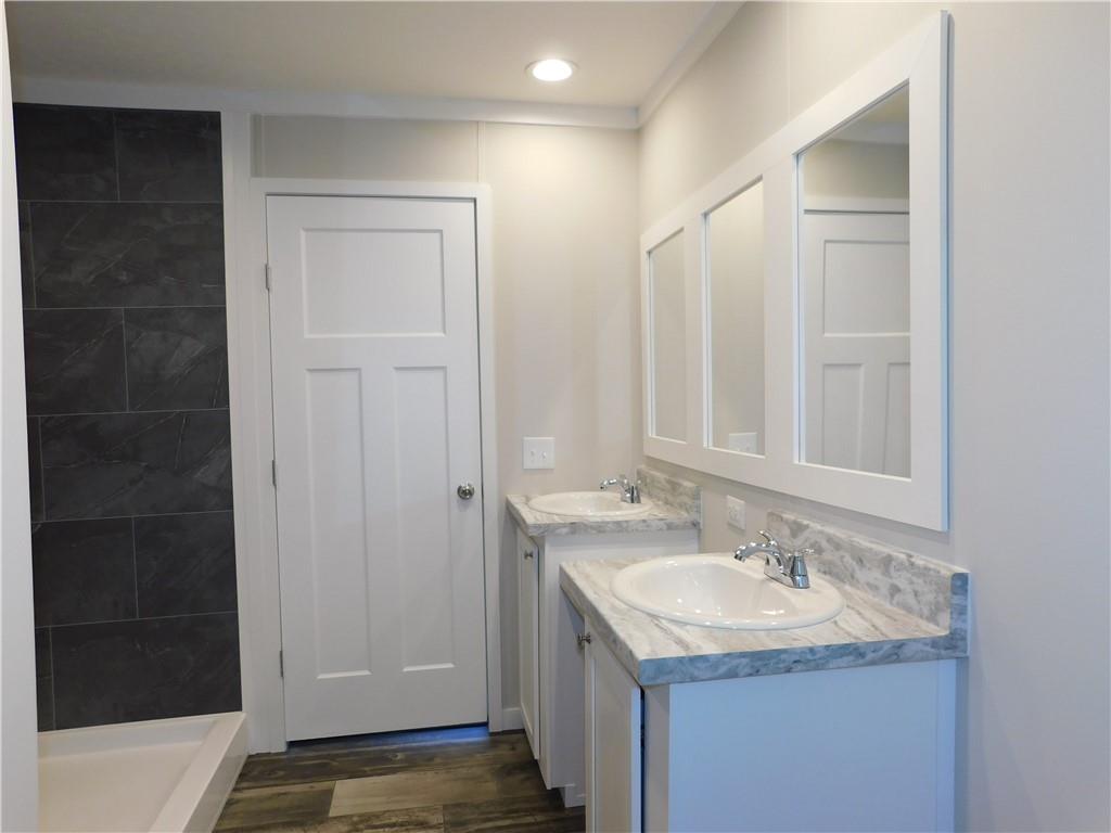 350 Galahad Road Dahlonega, GA 30533 - Photo 28 of 39 a bathroom with a sink and a mirror