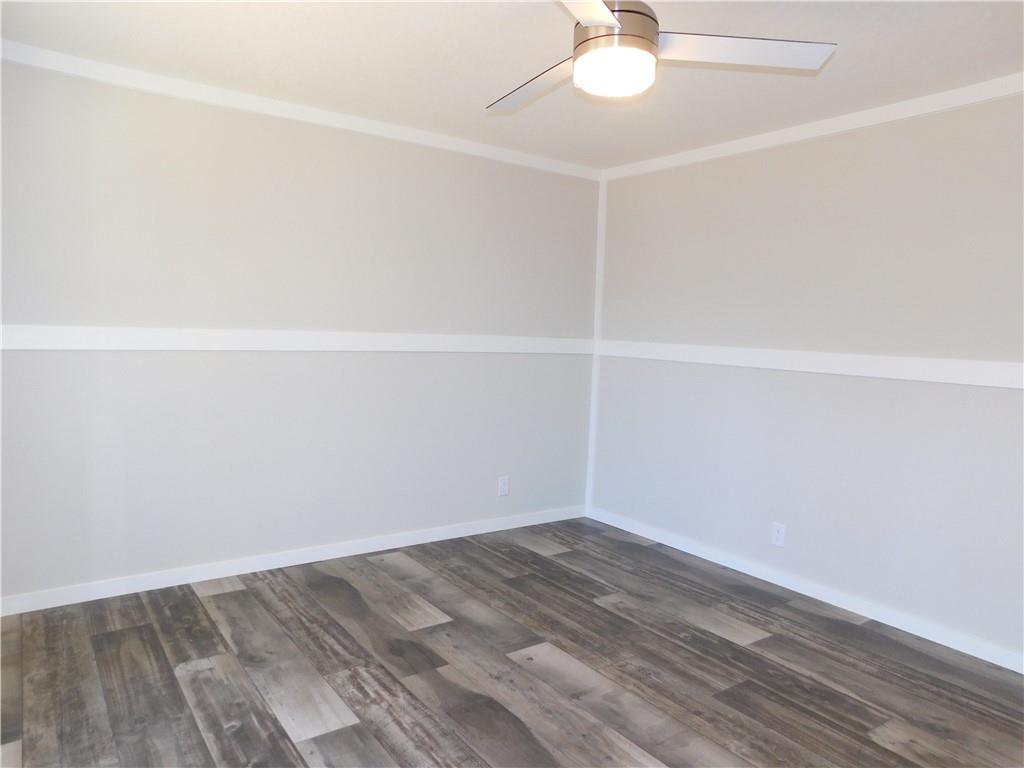 350 Galahad Road Dahlonega, GA 30533 - Photo 31 of 39 a view of a room with wooden floor and a ceiling fan