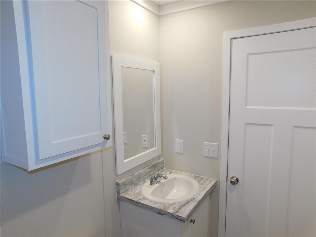 350 Galahad Road Dahlonega, GA 30533 - Photo 34 of 39 a bathroom with a sink and a mirror