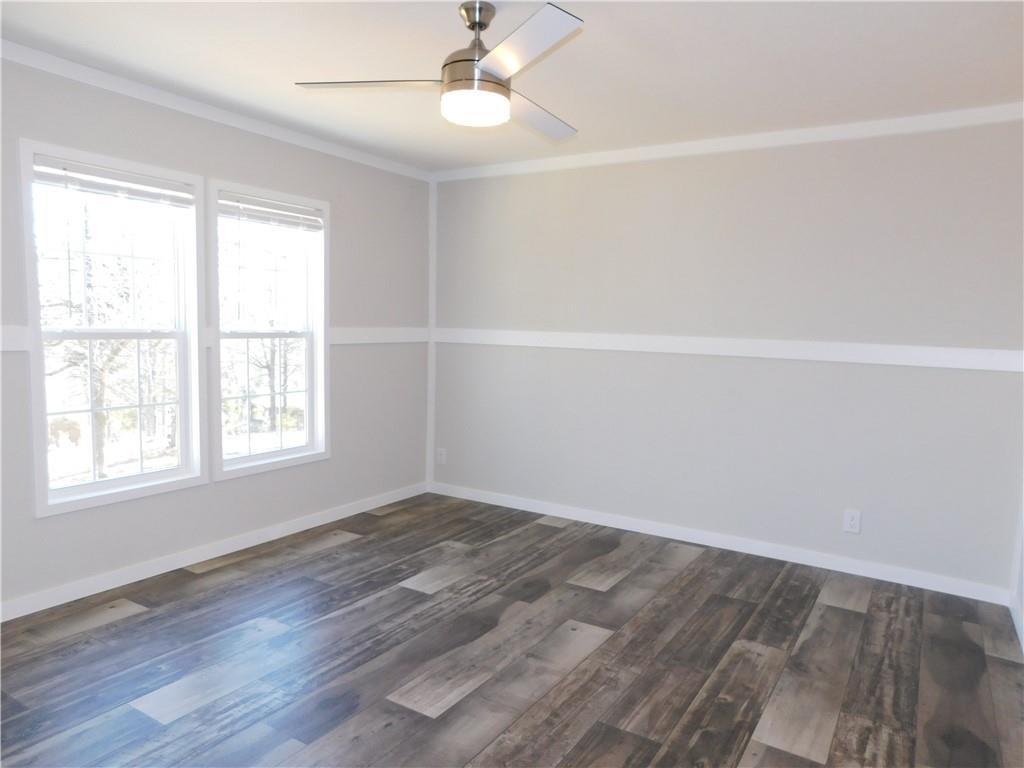 350 Galahad Road Dahlonega, GA 30533 - Photo 35 of 39 wooden floor in an empty room with a window