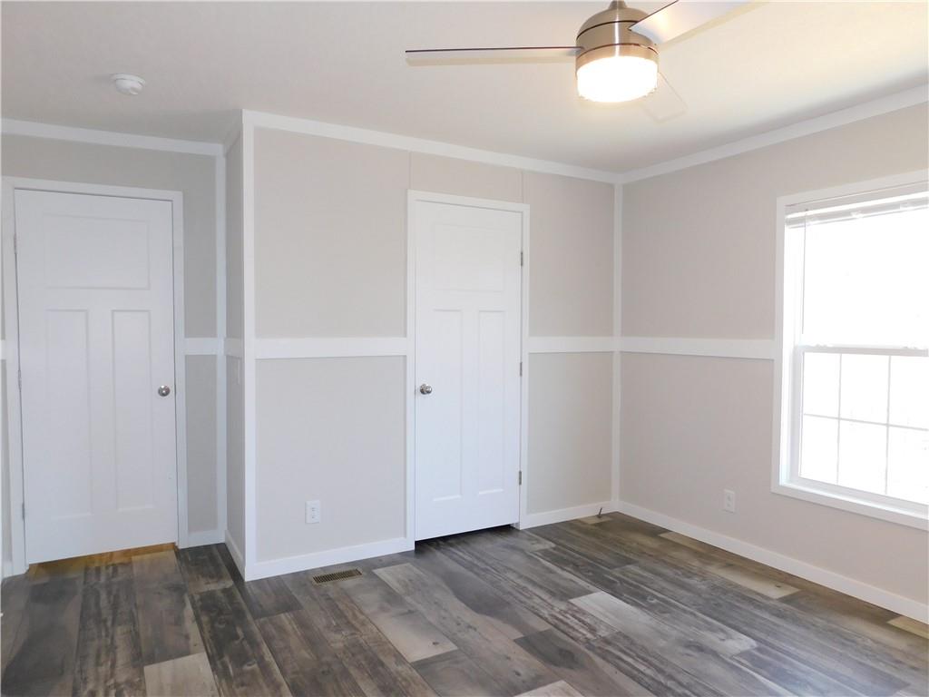 350 Galahad Road Dahlonega, GA 30533 - Photo 37 of 39 a view of an empty room with wooden floor and a window