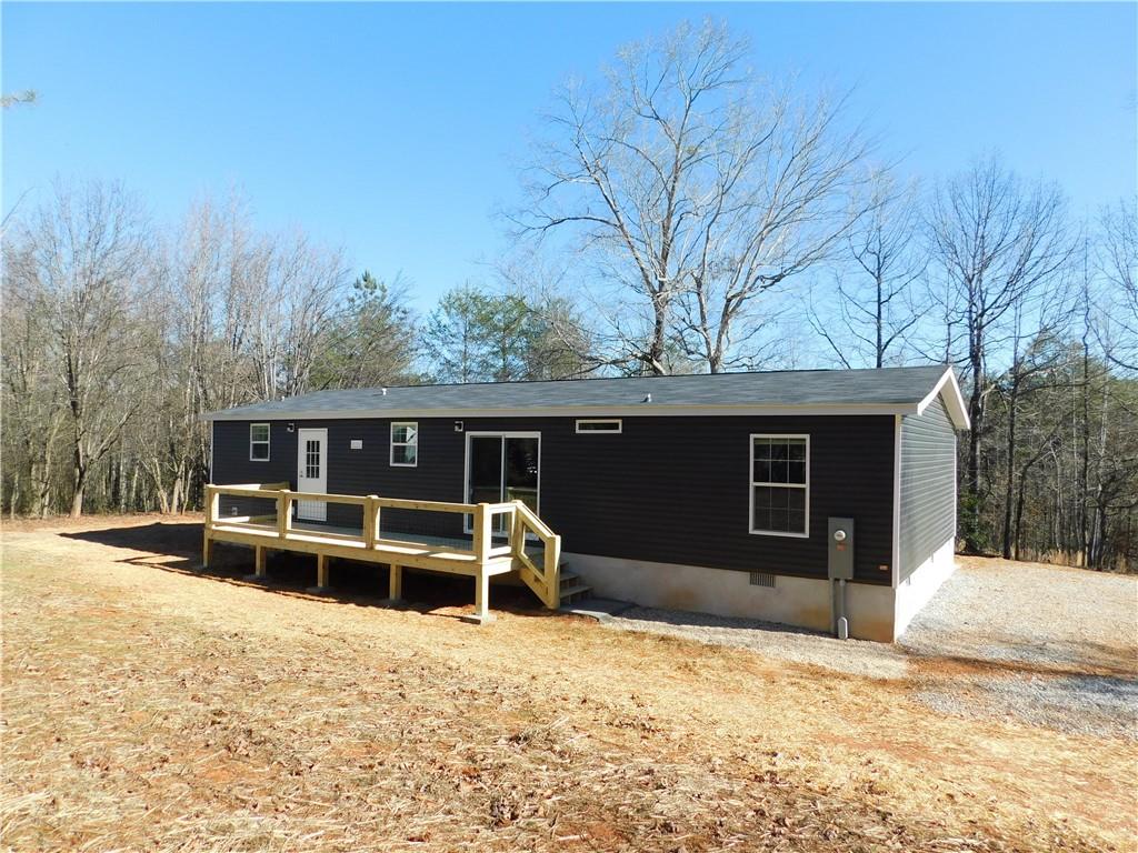 350 Galahad Road Dahlonega, GA 30533 - Photo 38 of 39 a front view of house with yard and trees in the background