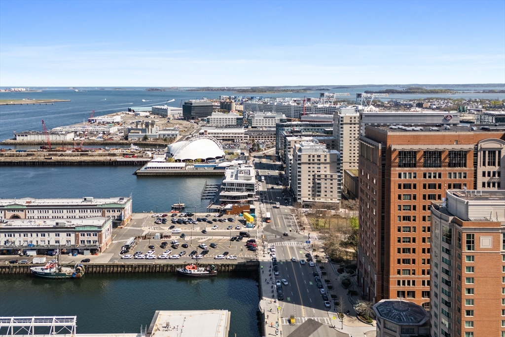 135 Seaport Boulevard, Unit 1902 Boston, MA 02210 - Photo 39 of 40 a view of a city and ocean view