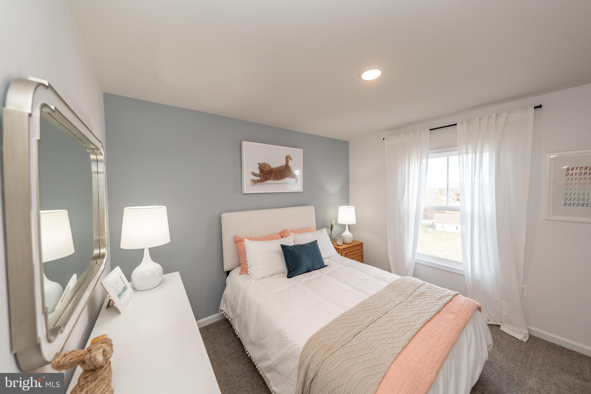 121 Indian Hills Road Locust Grove, VA 22508 - Photo 21 of 26 a bedroom with a bed and window
