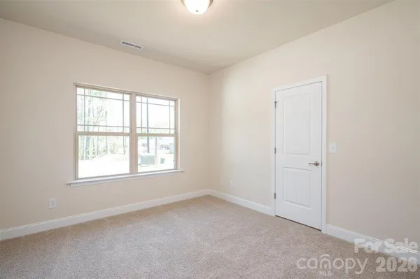 a bathroom with a sink toilet vanity and shower