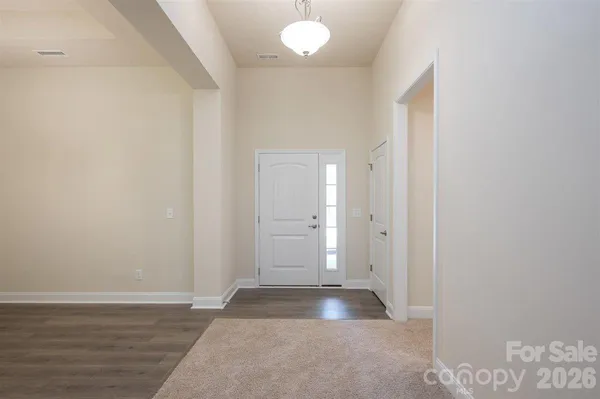 a view of a chandelier in an empty room
