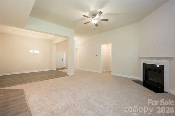 a view of kitchen with a sink cabinets and window