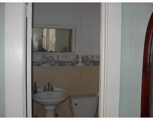 a bathroom with a sink vanity and mirror