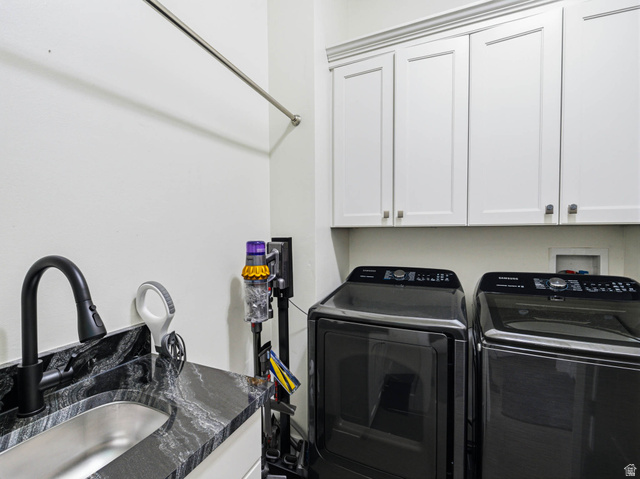 1154 Sunset Dunes Way Draper, UT 84020 - Photo 35 of 50 Laundry room with cabinet space and independent washer and dryer