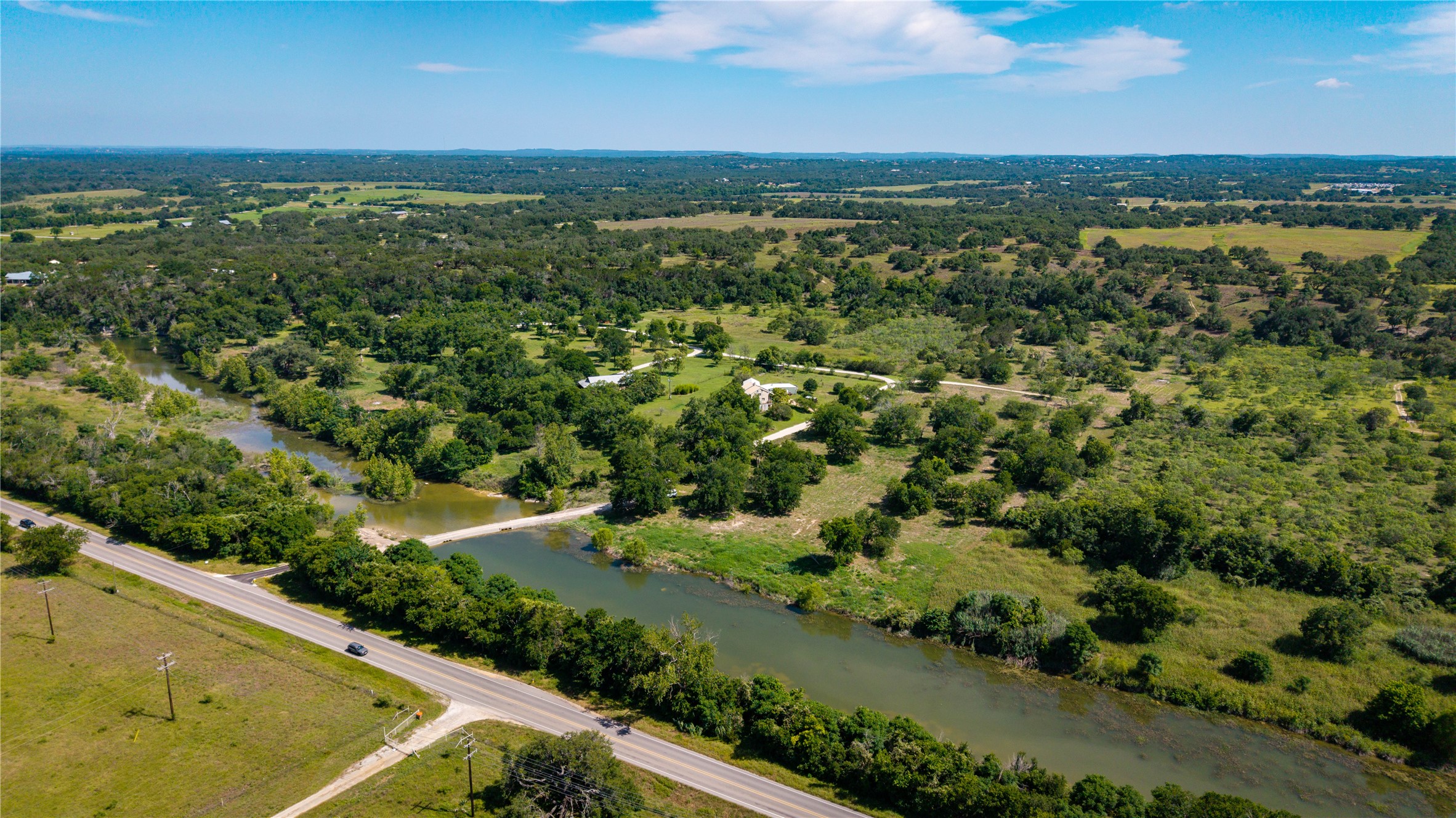 Tbd Lost Acres Loop Blanco, TX 78606 - Photo 32 of 39 an aerial view of residential houses with outdoor space and trees