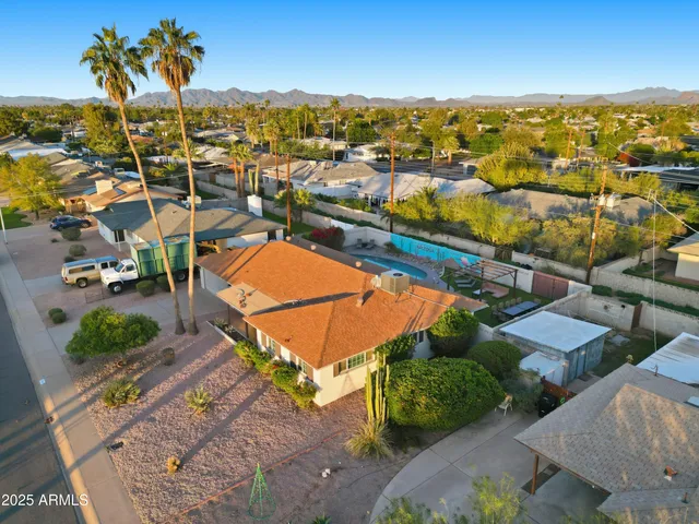 an aerial view of residential houses and outdoor space