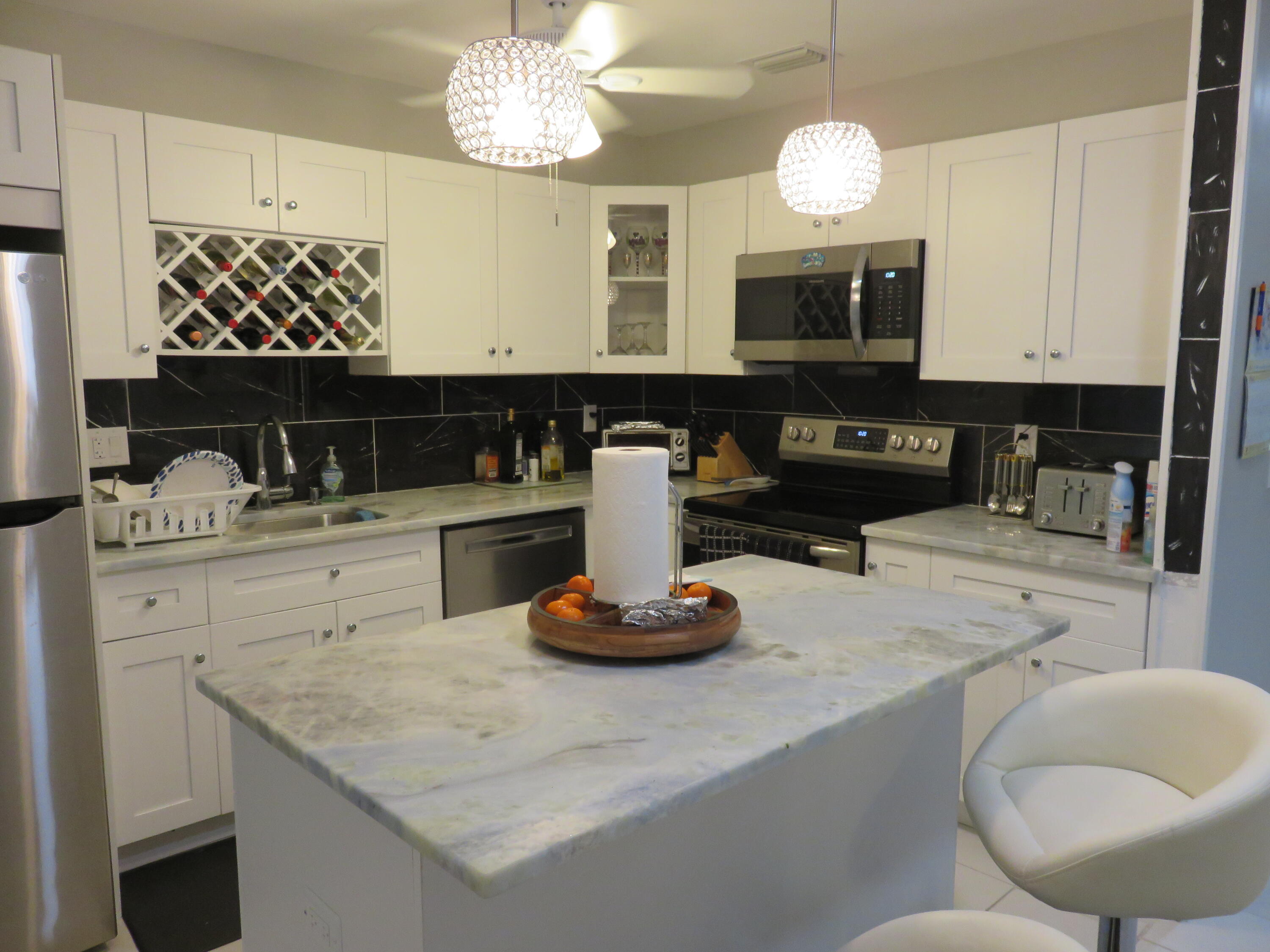 8710 Chevy Chase Drive Boca Raton, FL 33433 - Photo 2 of 10 9A2395FF-E0B4-4AF2-96FF-C37479E43CBB