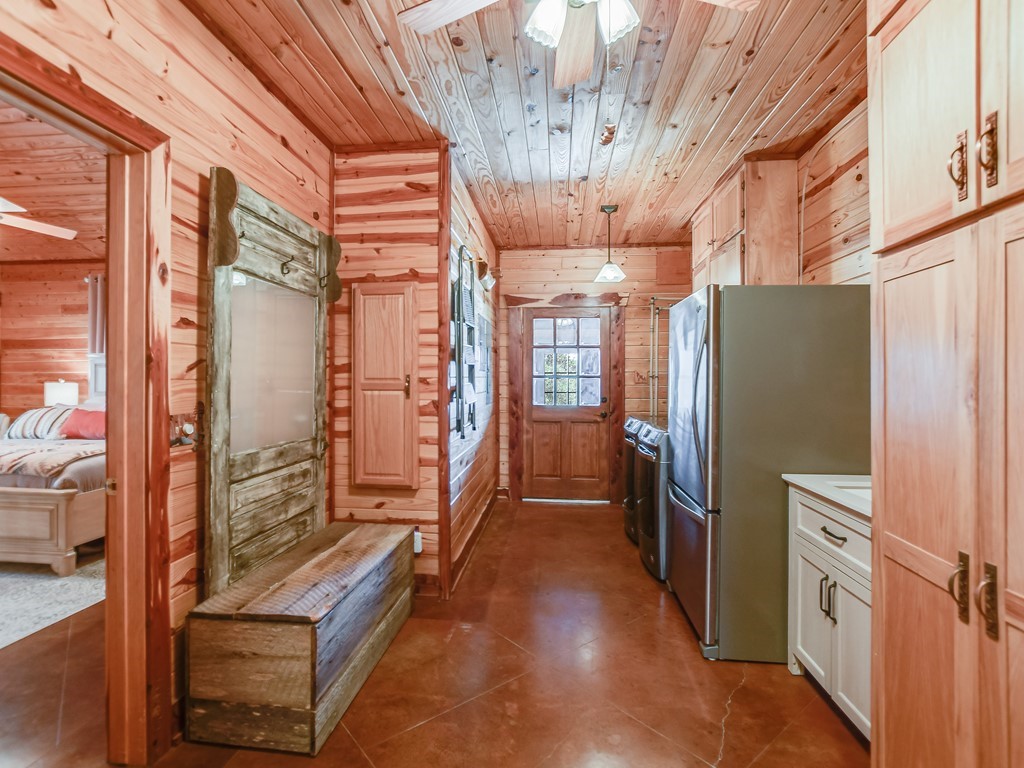 254 Middleton Road Spicewood, TX 78669 - Photo 9 of 32 a view of an entryway with wooden floor