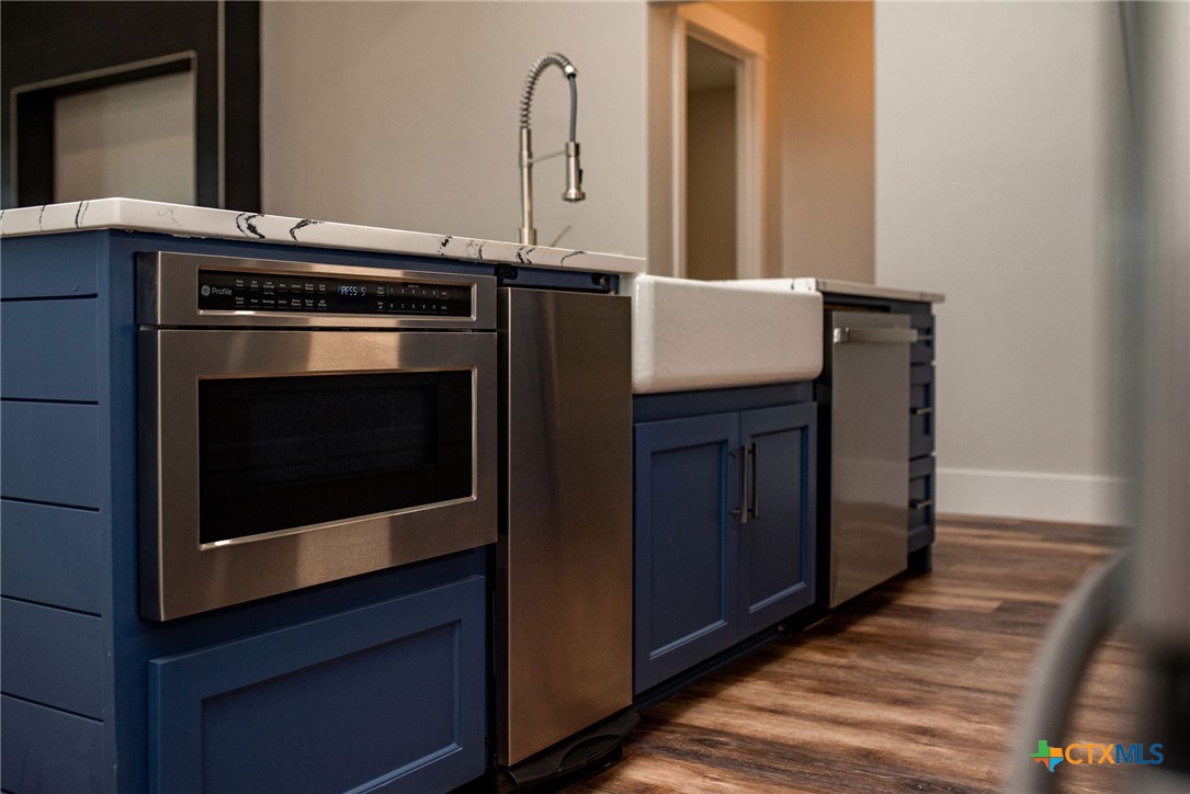 2062 Harrison Avenue Port O'Connor, TX 77982 - Photo 14 of 48 a stove top oven sitting inside of a kitchen