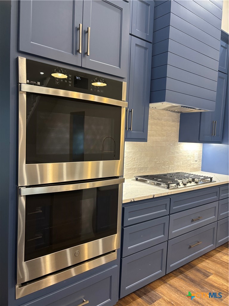 2062 Harrison Avenue Port O'Connor, TX 77982 - Photo 17 of 48 a stove top oven sitting inside of a kitchen
