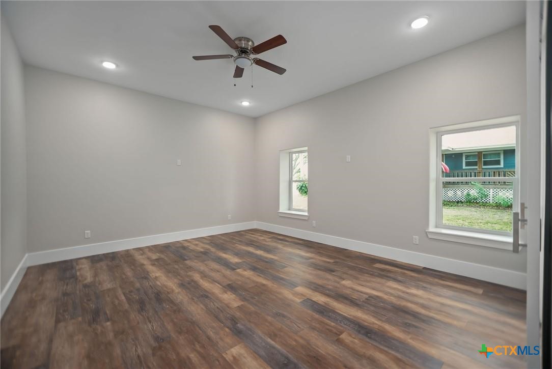 2062 Harrison Avenue Port O'Connor, TX 77982 - Photo 21 of 48 an empty room with windows