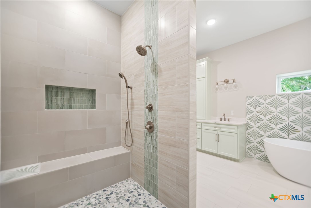 2062 Harrison Avenue Port O'Connor, TX 77982 - Photo 24 of 48 a bathroom with a bathtub and shower