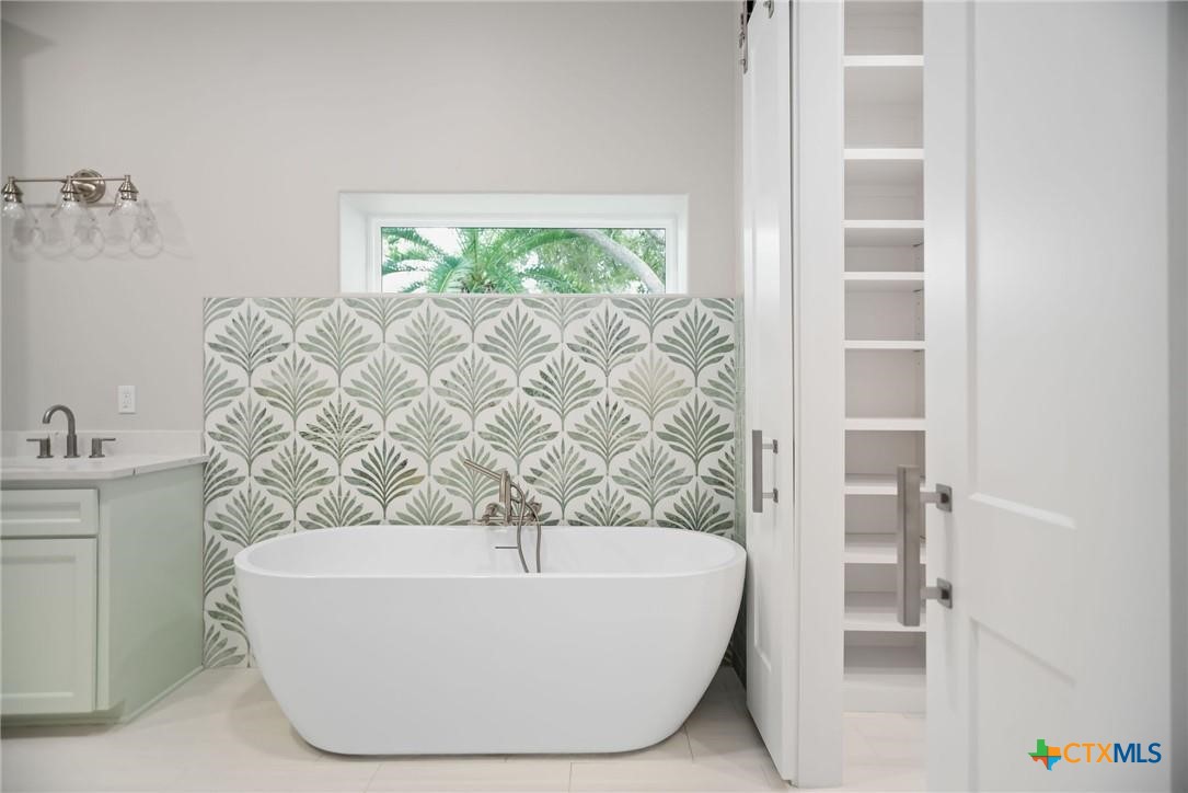 2062 Harrison Avenue Port O'Connor, TX 77982 - Photo 25 of 48 a white bath tub sitting in a bathroom