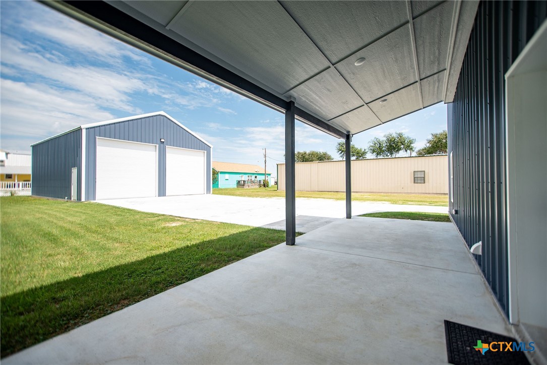 2062 Harrison Avenue Port O'Connor, TX 77982 - Photo 3 of 48 a view of an entryway with a garden