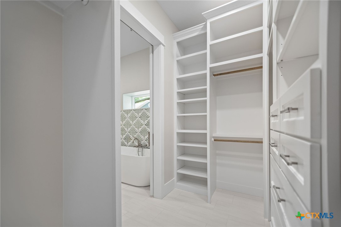 2062 Harrison Avenue Port O'Connor, TX 77982 - Photo 31 of 48 a view of walk in closet with empty racks