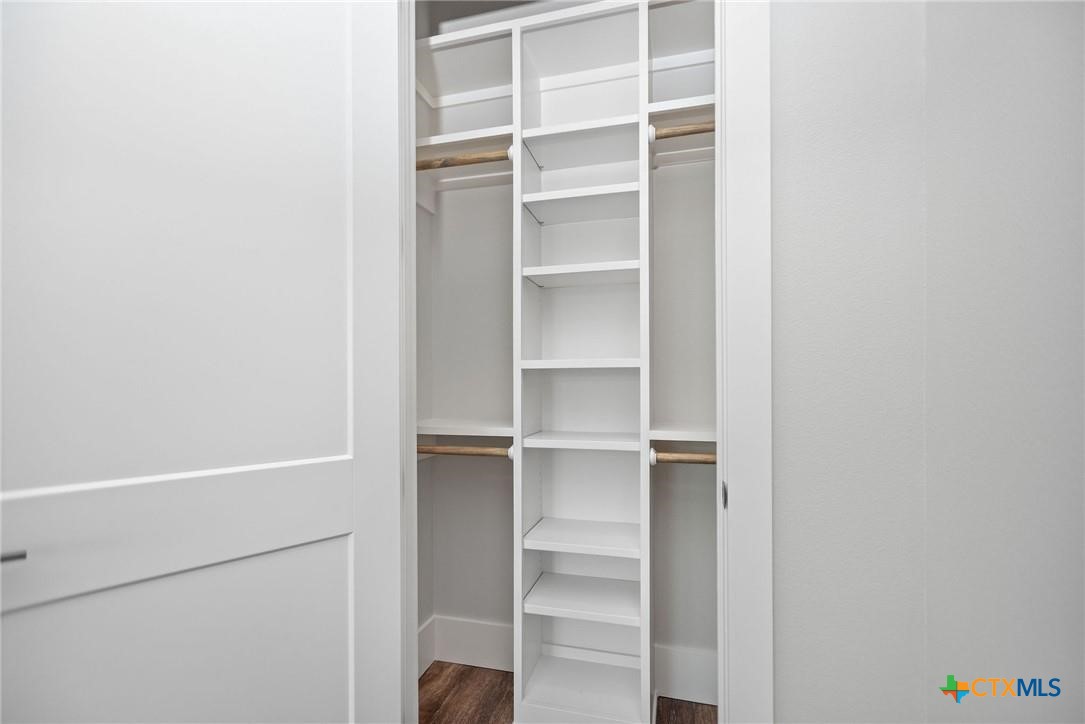 2062 Harrison Avenue Port O'Connor, TX 77982 - Photo 36 of 48 a view of walk in closet with empty racks