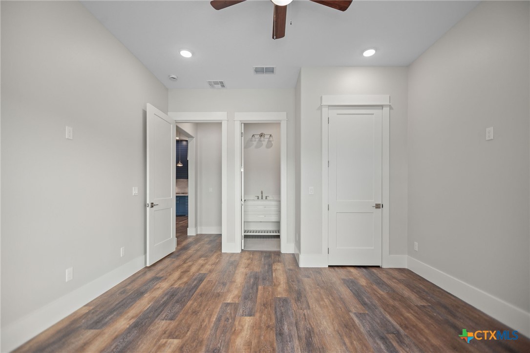 2062 Harrison Avenue Port O'Connor, TX 77982 - Photo 38 of 48 wooden floor in an empty room with a window