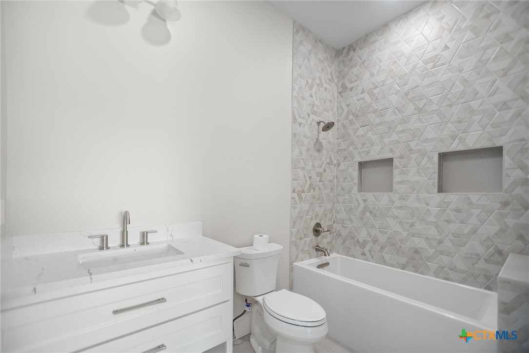 2062 Harrison Avenue Port O'Connor, TX 77982 - Photo 40 of 48 a bathroom with a sink a toilet and bathtub