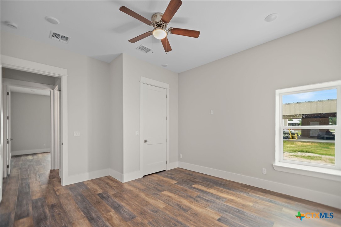 2062 Harrison Avenue Port O'Connor, TX 77982 - Photo 42 of 48 a view of empty room with wooden floor and fan
