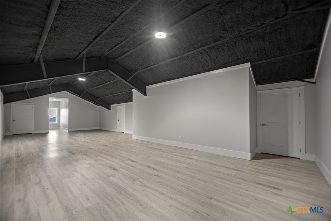 2062 Harrison Avenue Port O'Connor, TX 77982 - Photo 46 of 48 a view of an empty room with wooden floor