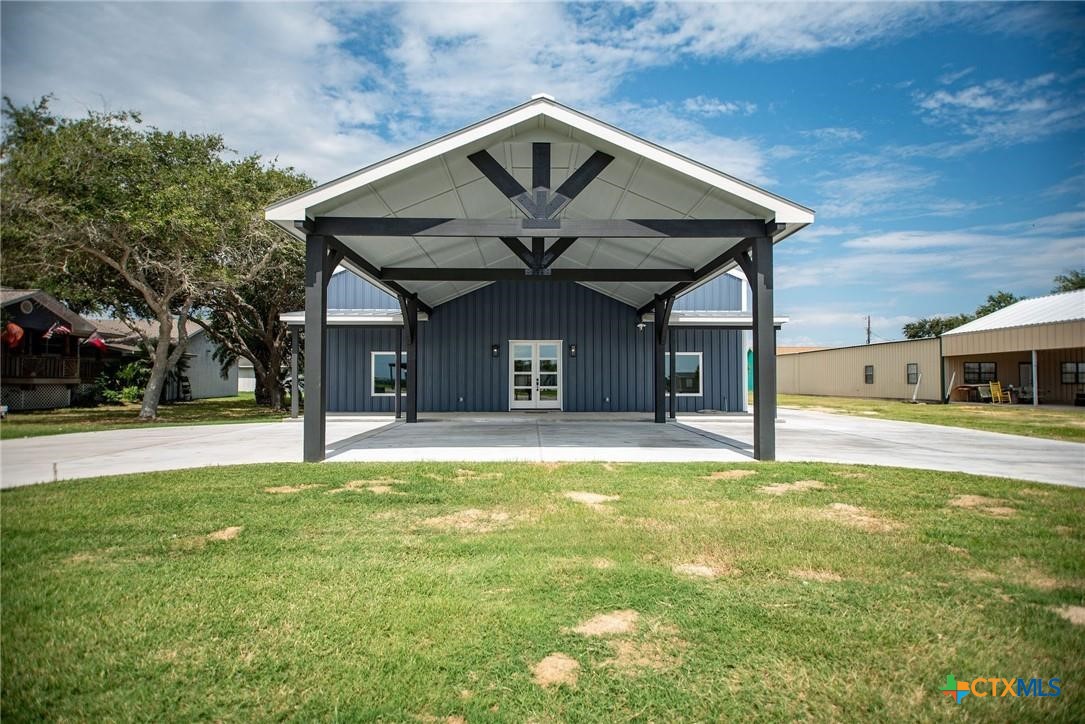 2062 Harrison Avenue Port O'Connor, TX 77982 - Photo 6 of 48 a view of a house with a large space and a swimming pool
