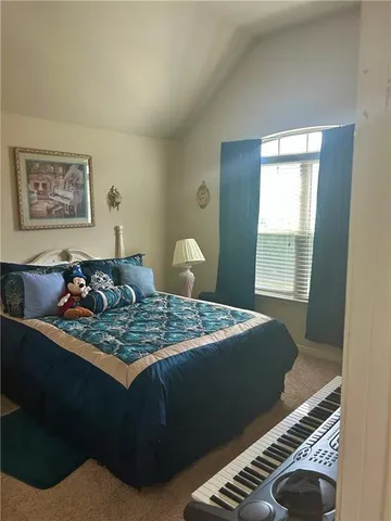 a room with furniture projector and screen