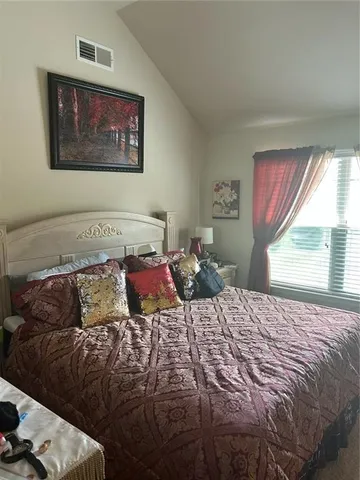 a room with gym equipment and a large window