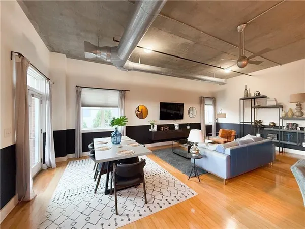 a living room with furniture and a flat screen tv
