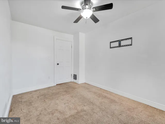 a view of a big room with carpet