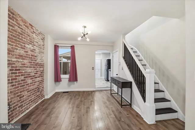 a kitchen with stainless steel appliances granite countertop a stove a refrigerator and a microwave