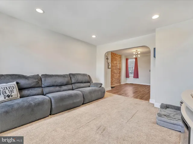 a living room with a couch and a large window