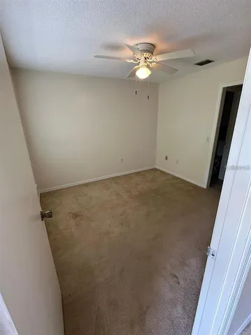 wooden floor in an empty room with a mirror