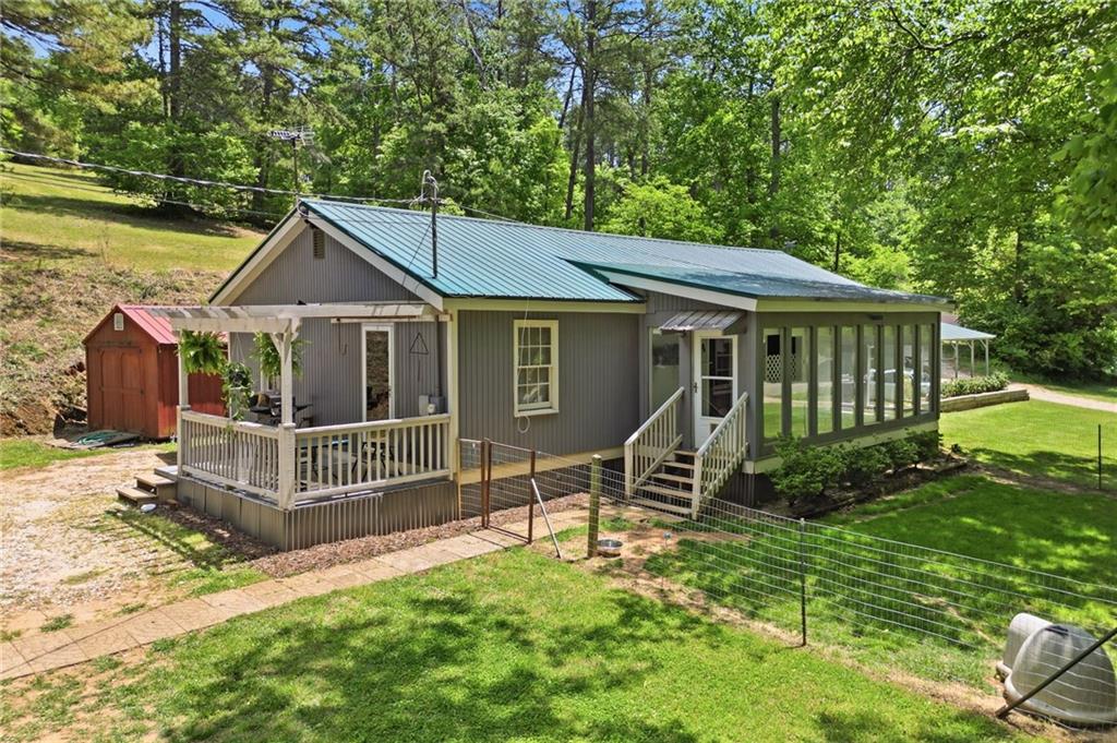 1709 Harrington Road Ball Ground, GA 30107 - Photo 27 of 46 a view of a house with a yard