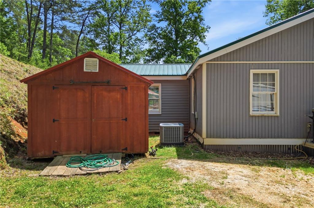 1709 Harrington Road Ball Ground, GA 30107 - Photo 33 of 46 a front view of a house with garden