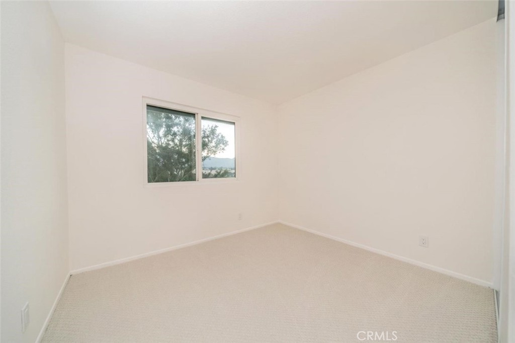 1118 Fallbrook Drive Corona, CA 92878 - Photo 16 of 30 an empty room with a window