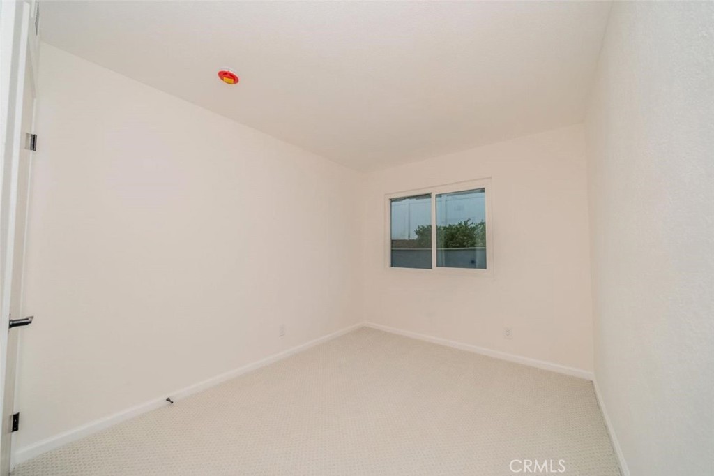1118 Fallbrook Drive Corona, CA 92878 - Photo 18 of 30 an empty room with a window