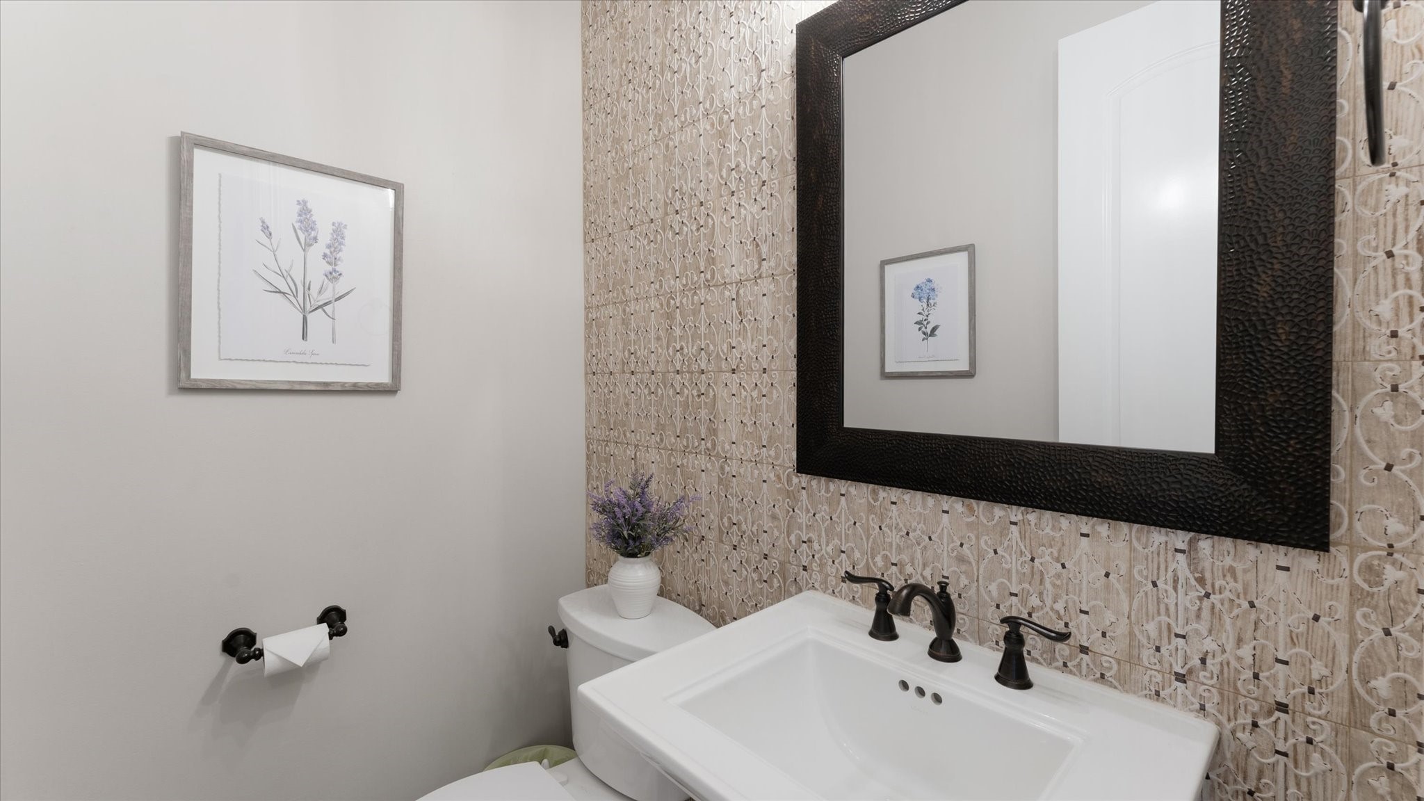 24 Longhorn Loop New Waverly, TX 77358 - Photo 13 of 45 a bathroom with a toilet sink and mirror