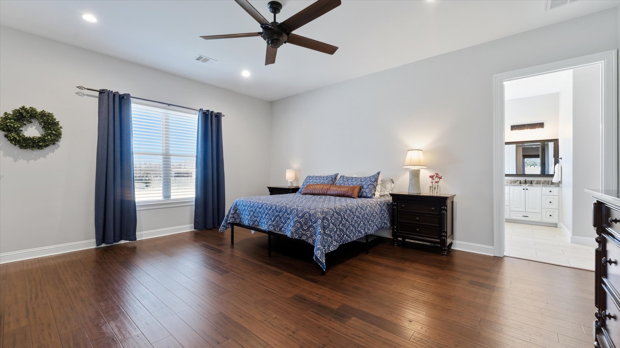 24 Longhorn Loop New Waverly, TX 77358 - Photo 14 of 45 a bedroom with a bed and a window