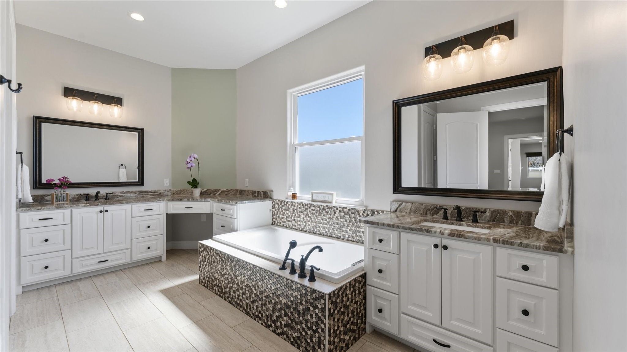 24 Longhorn Loop New Waverly, TX 77358 - Photo 15 of 45 a bathroom with a granite countertop double vanity sink a mirror and bathtub