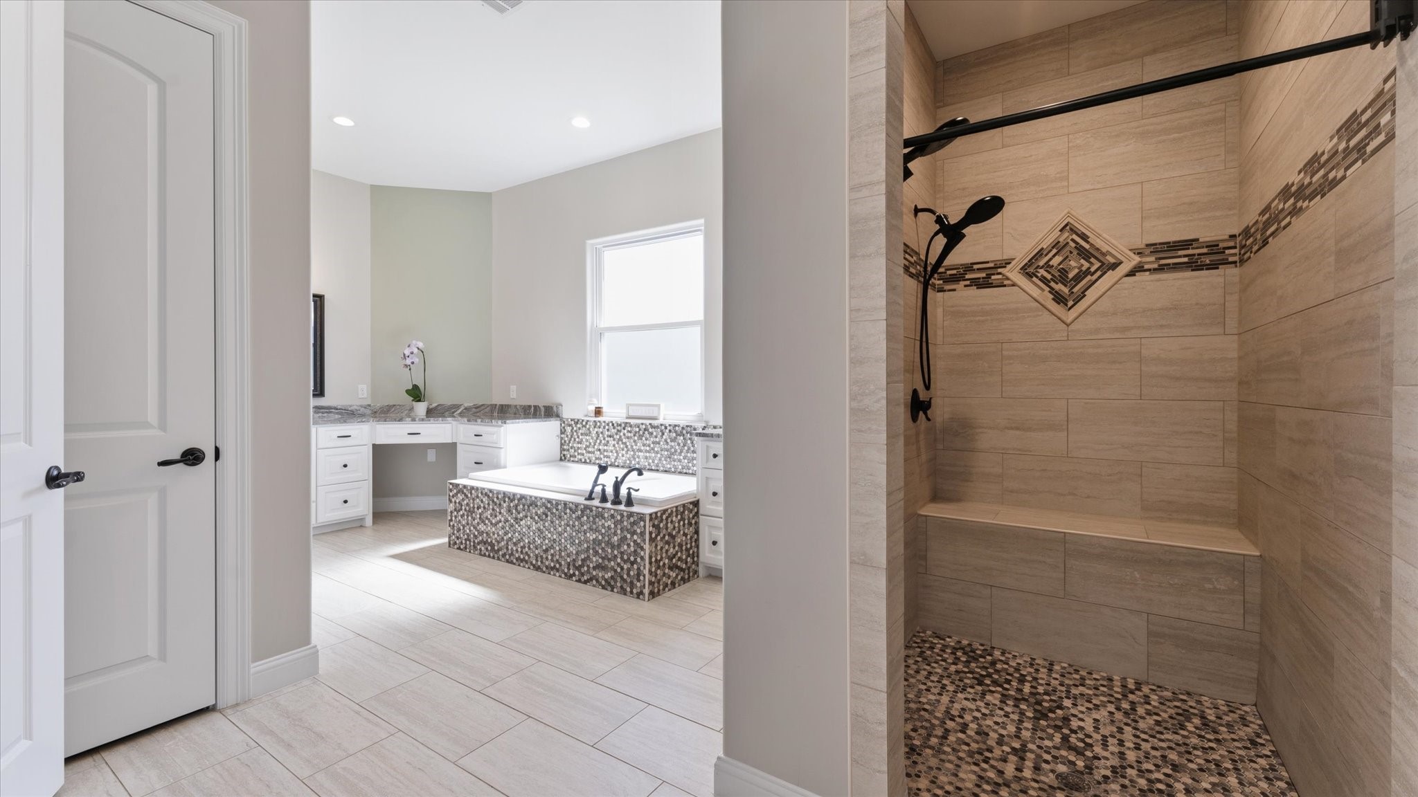 24 Longhorn Loop New Waverly, TX 77358 - Photo 16 of 45 a bathroom with a bathtub and shower