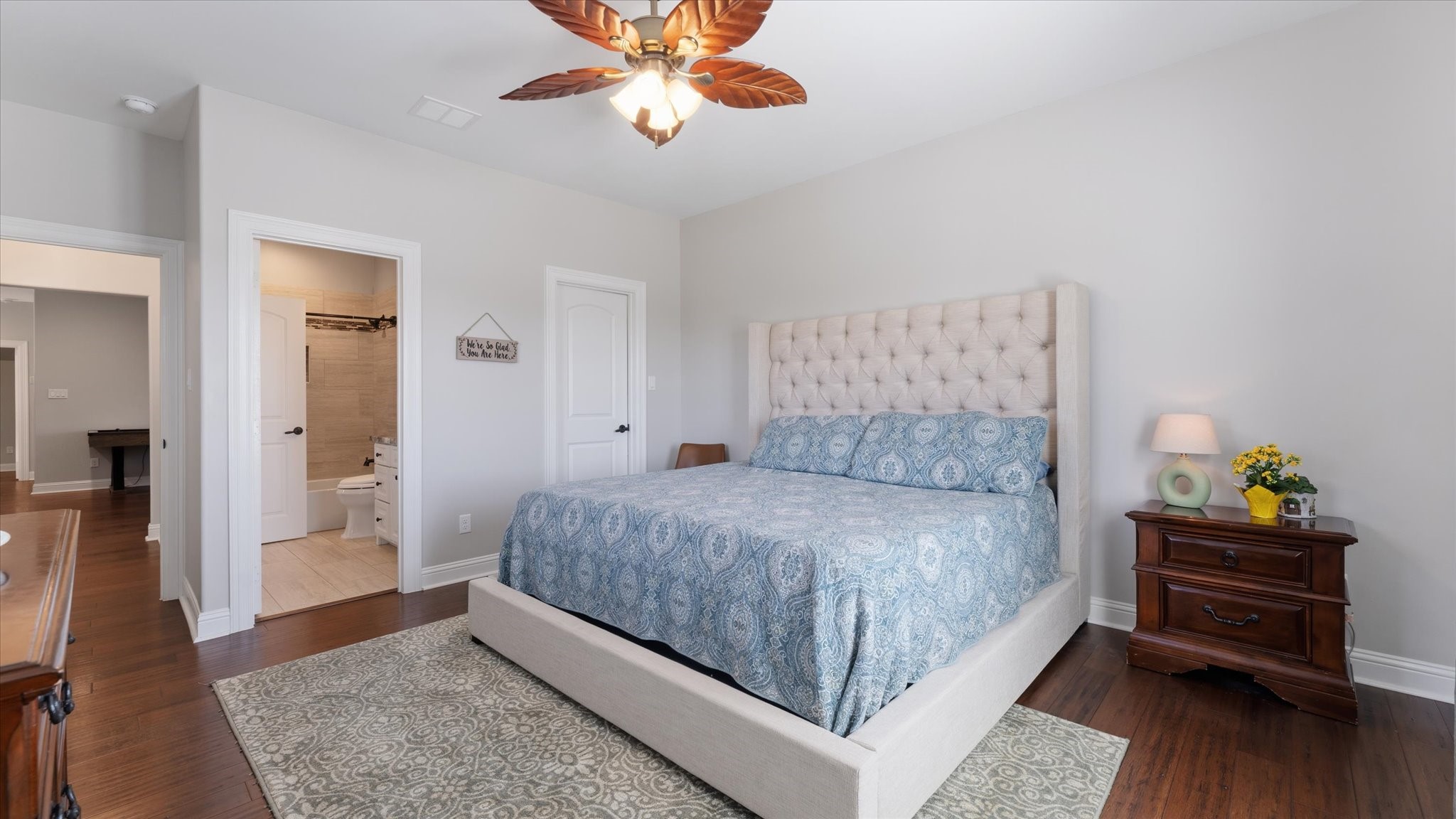 24 Longhorn Loop New Waverly, TX 77358 - Photo 23 of 45 a bedroom with a bed and wooden floor